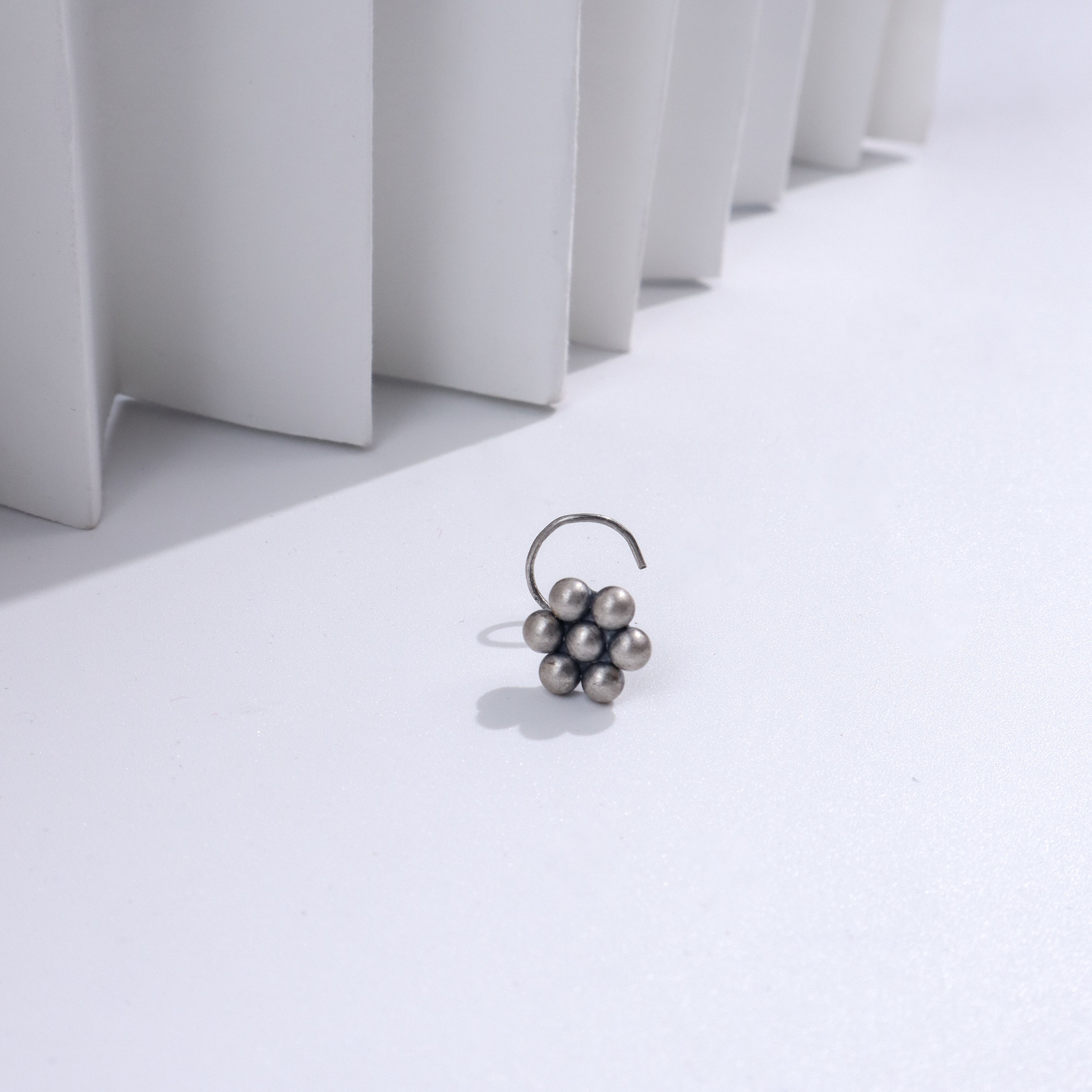 Sterling silver nosepin with oxidized finish, floral design, traditional jewelry