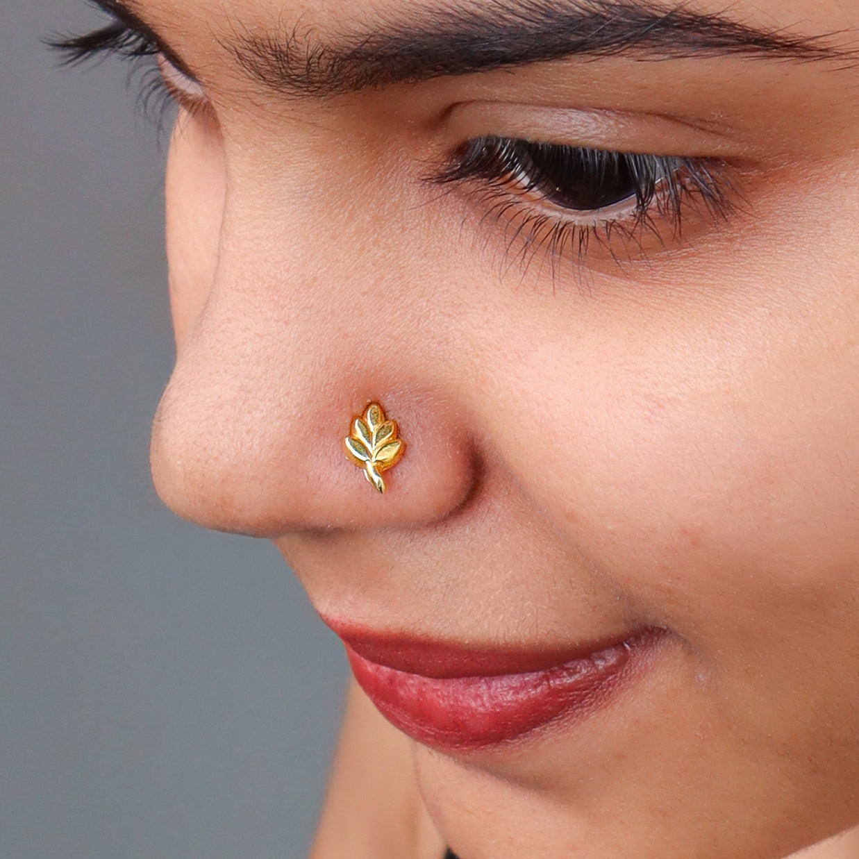 Gold leaf nose pin on pierced nose