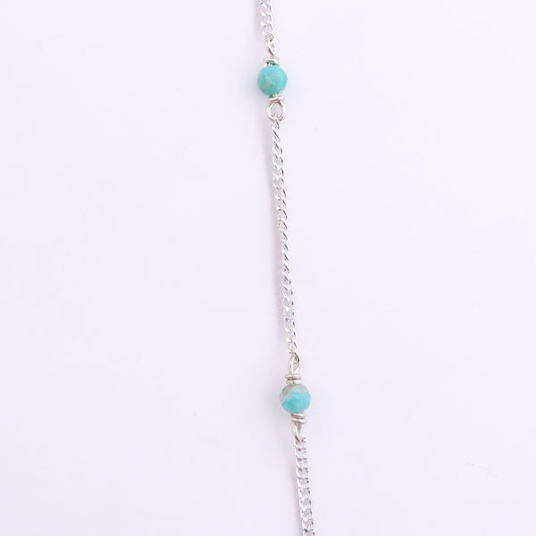 Silver chain with blue jade bead and clasp detail