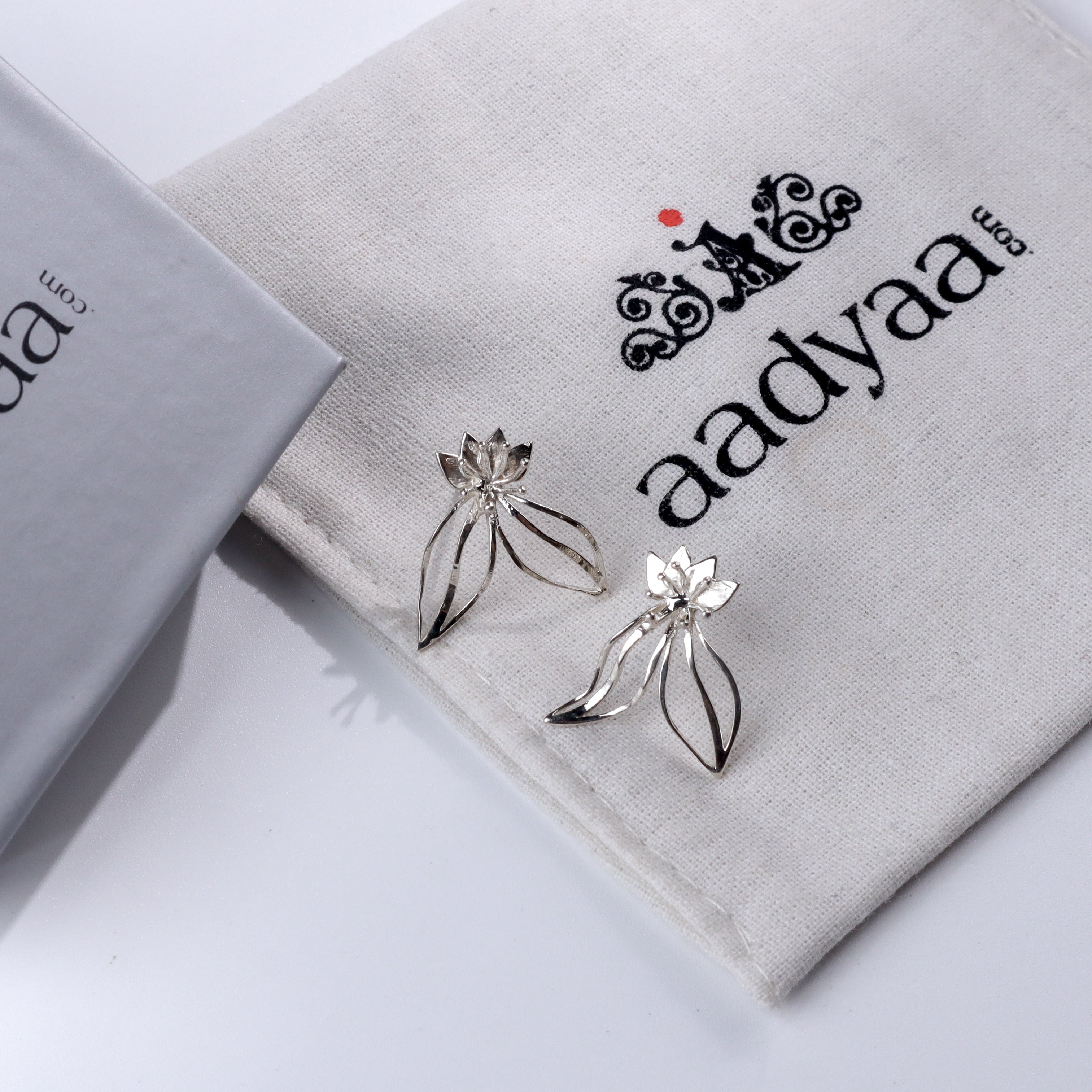 Saxifraga Flower Earrings on Aadyaa jewelry pouch