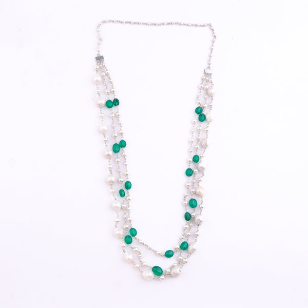 Close-up of freshwater pearl and green onyx necklace