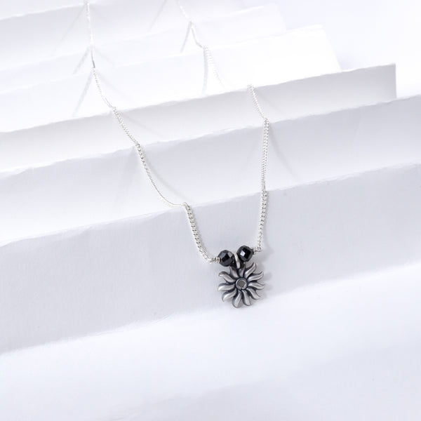 Silver Sun Charm Necklace with Black Beads