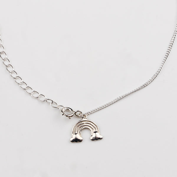 Close-up of silver starfish charm anklet detailing