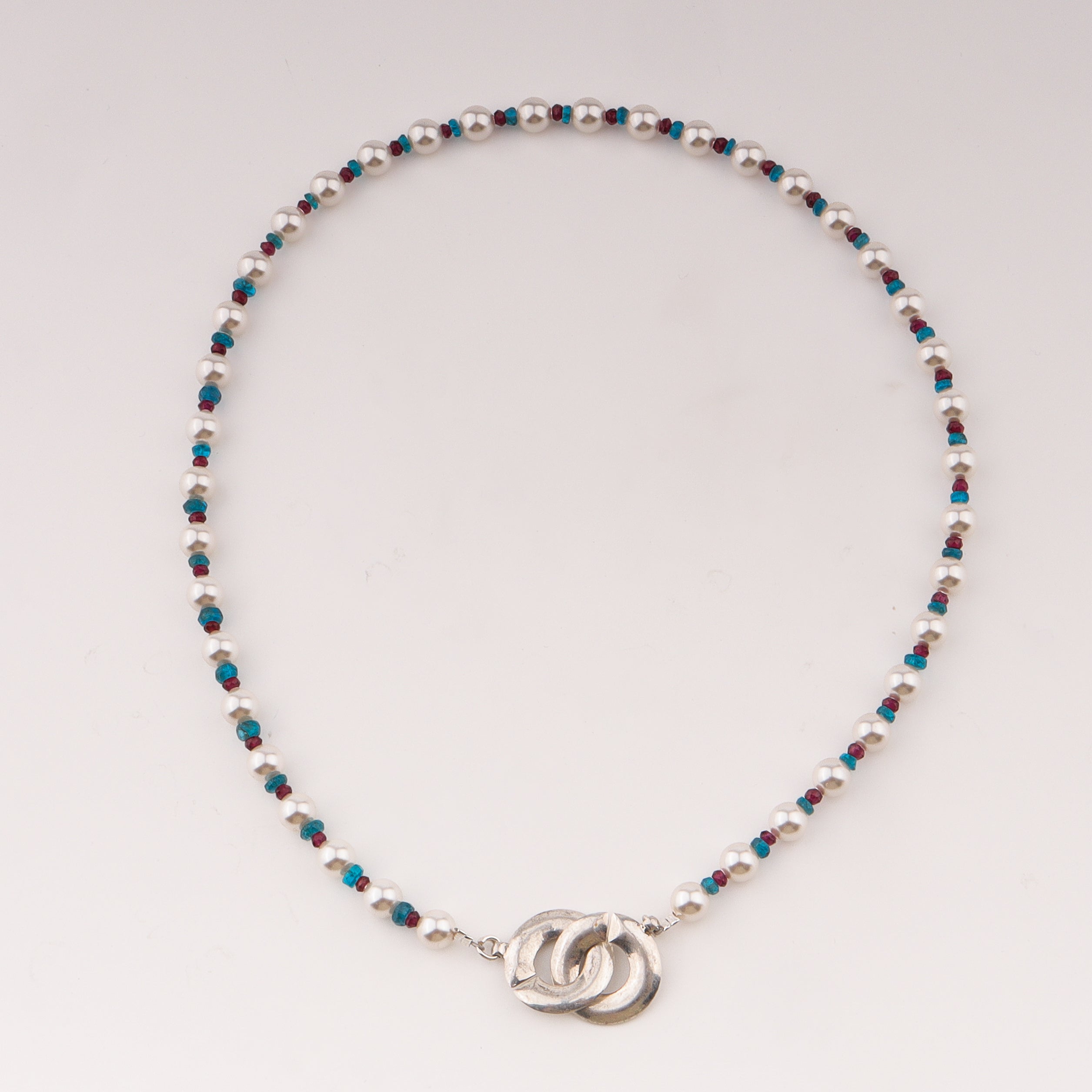 Infinity lock necklace with pearls and semipricious stones