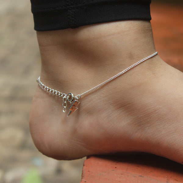 Close-up of silver storm charm anklet detailing