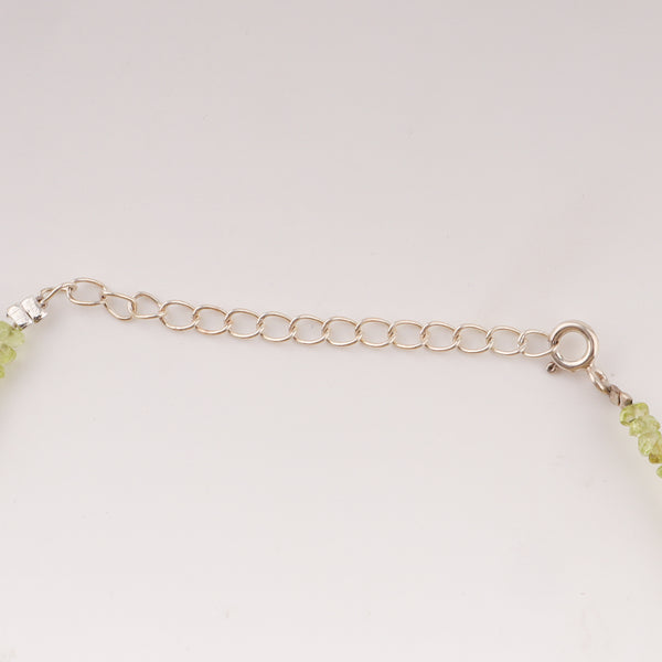 Silver chain extension of anklet with peridot stones