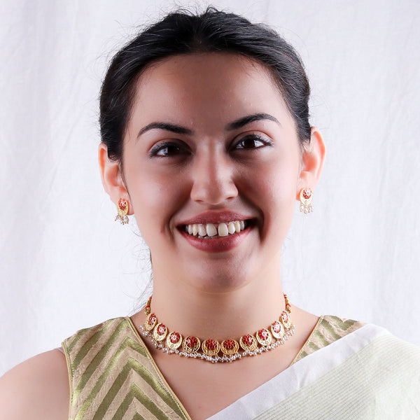 Elegant gold and red enamel necklace with pearl accents