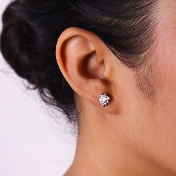 Close-up of silver earrings on white background