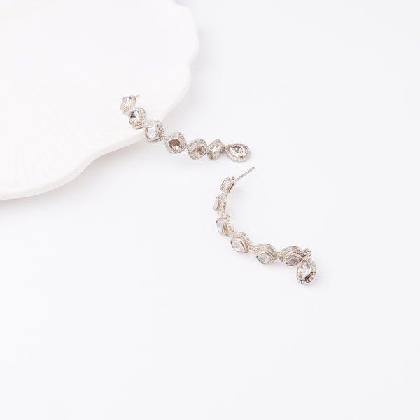White background showcasing sparkling moissanite earrings