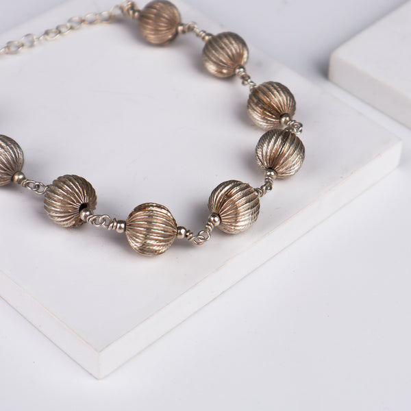 Silver beaded bracelet detail