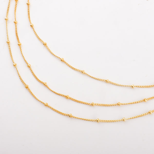 Multiple gold layered chain necklaces