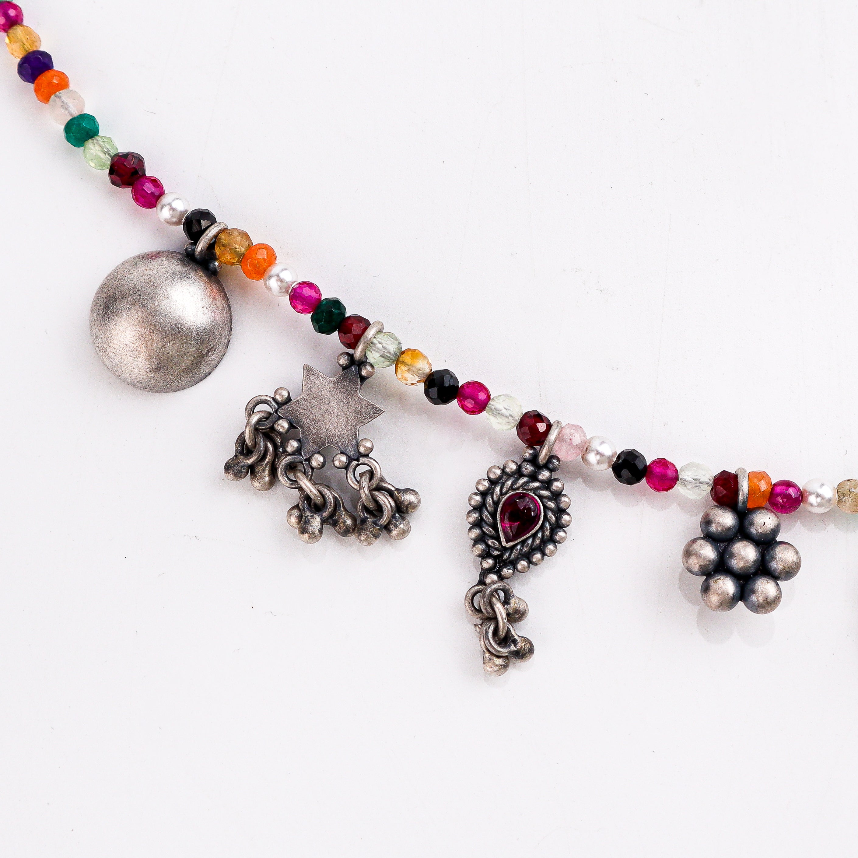 wear silver charms motifs necklace for everyday styling