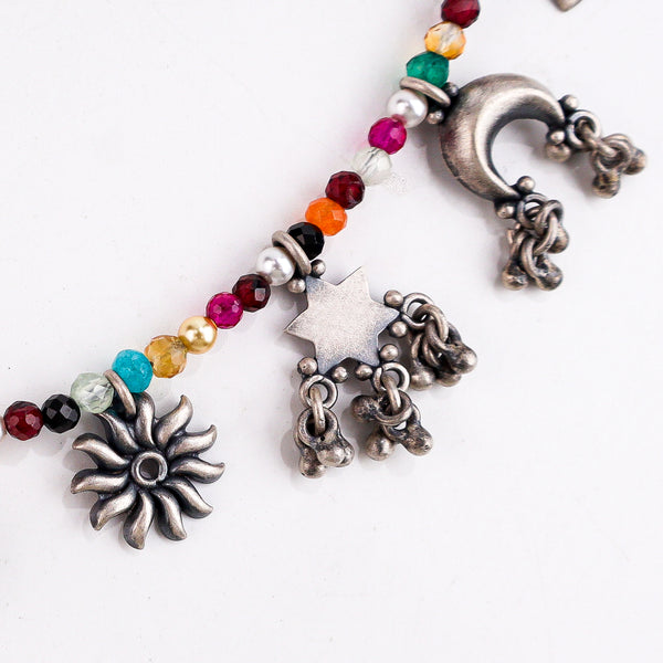 Charms motifs necklace styled with saree and modern outfit