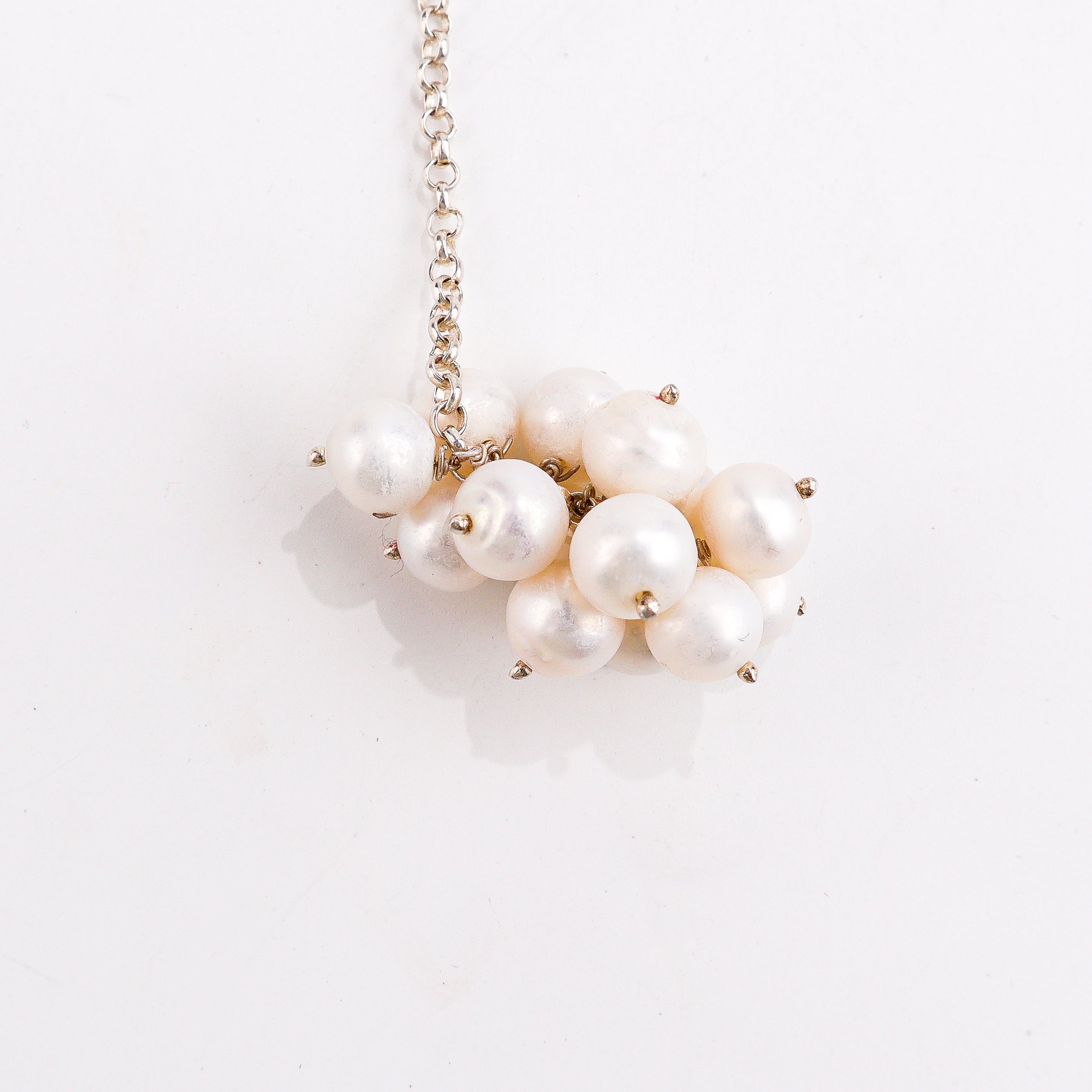 silver tie and wear necklace with pearls for daily styling