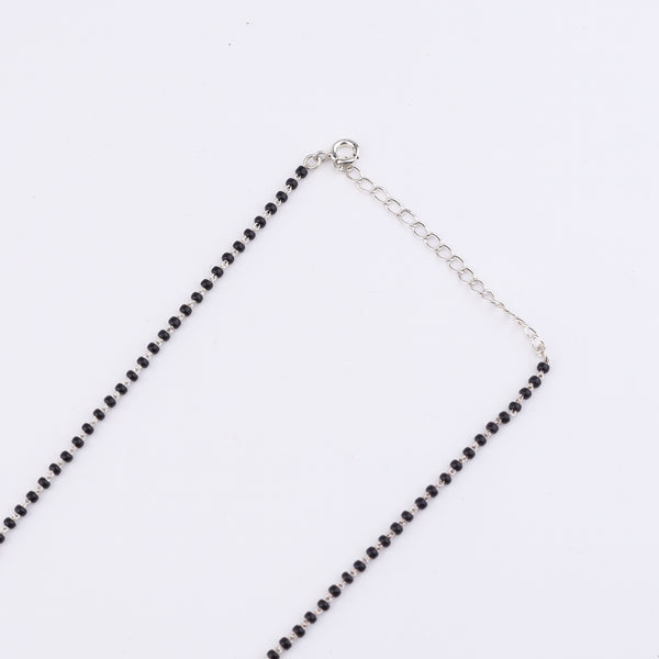 Silver mangalsutra chain with clasp on white background