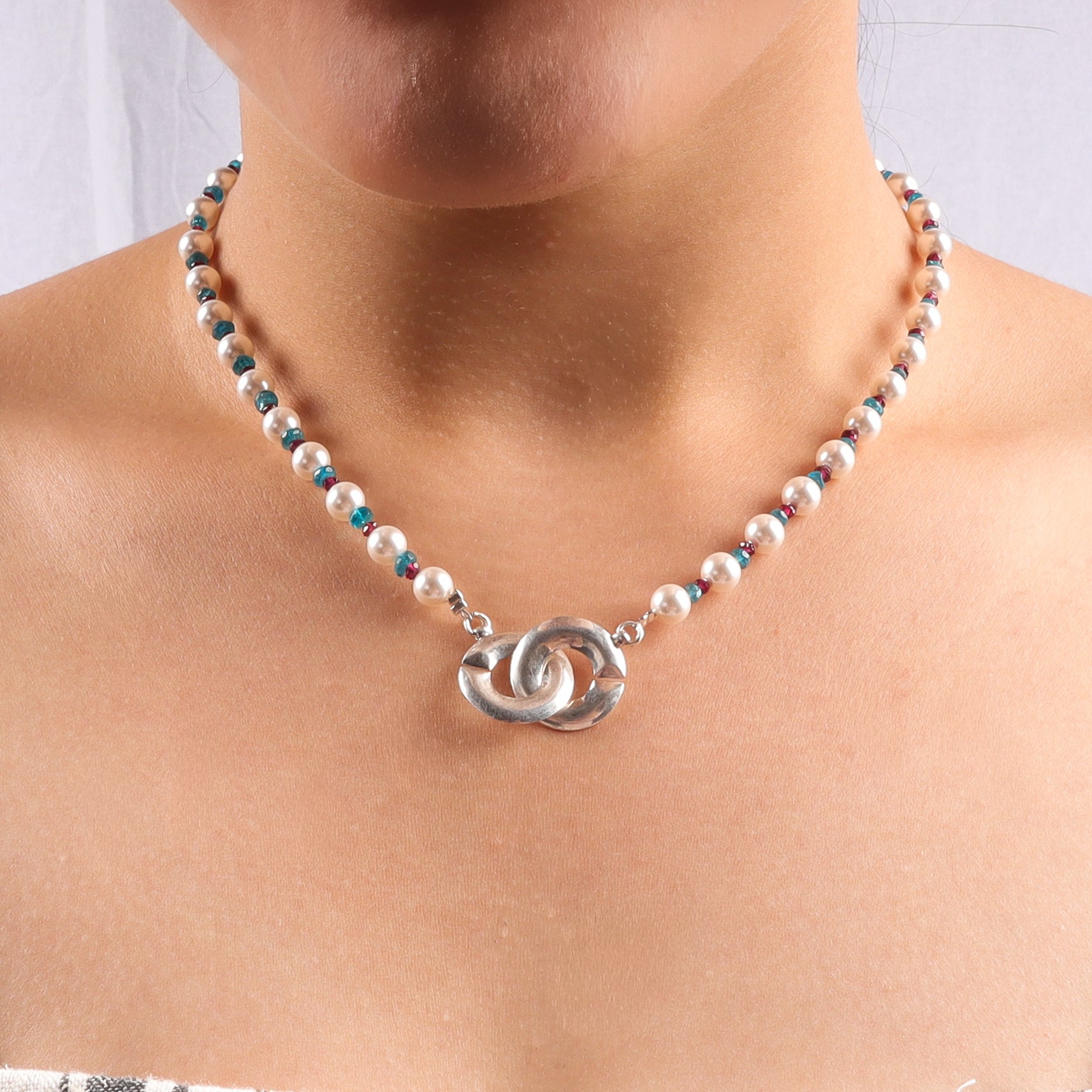 Infinity lock necklace with pearls and semipricious stones