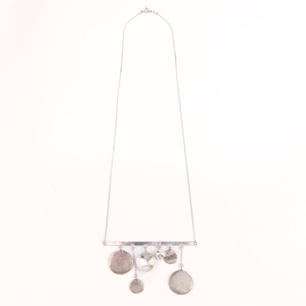 Coin vatee silver necklace styled with saree and Indo-western outfit
