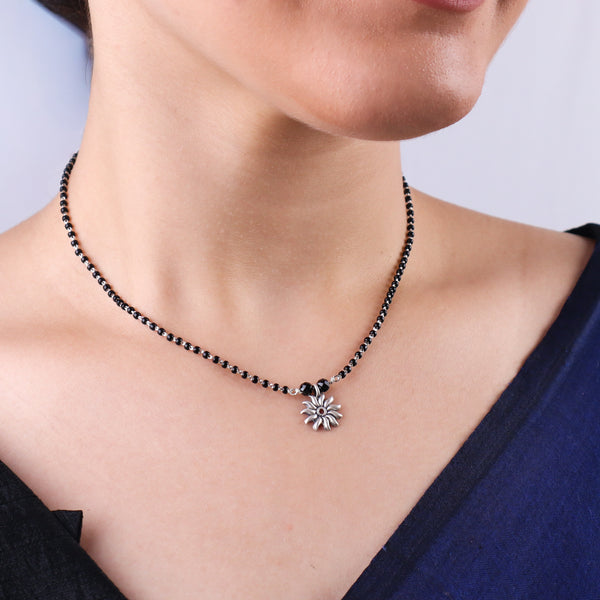 Sun motif silver mangalsutra detailing