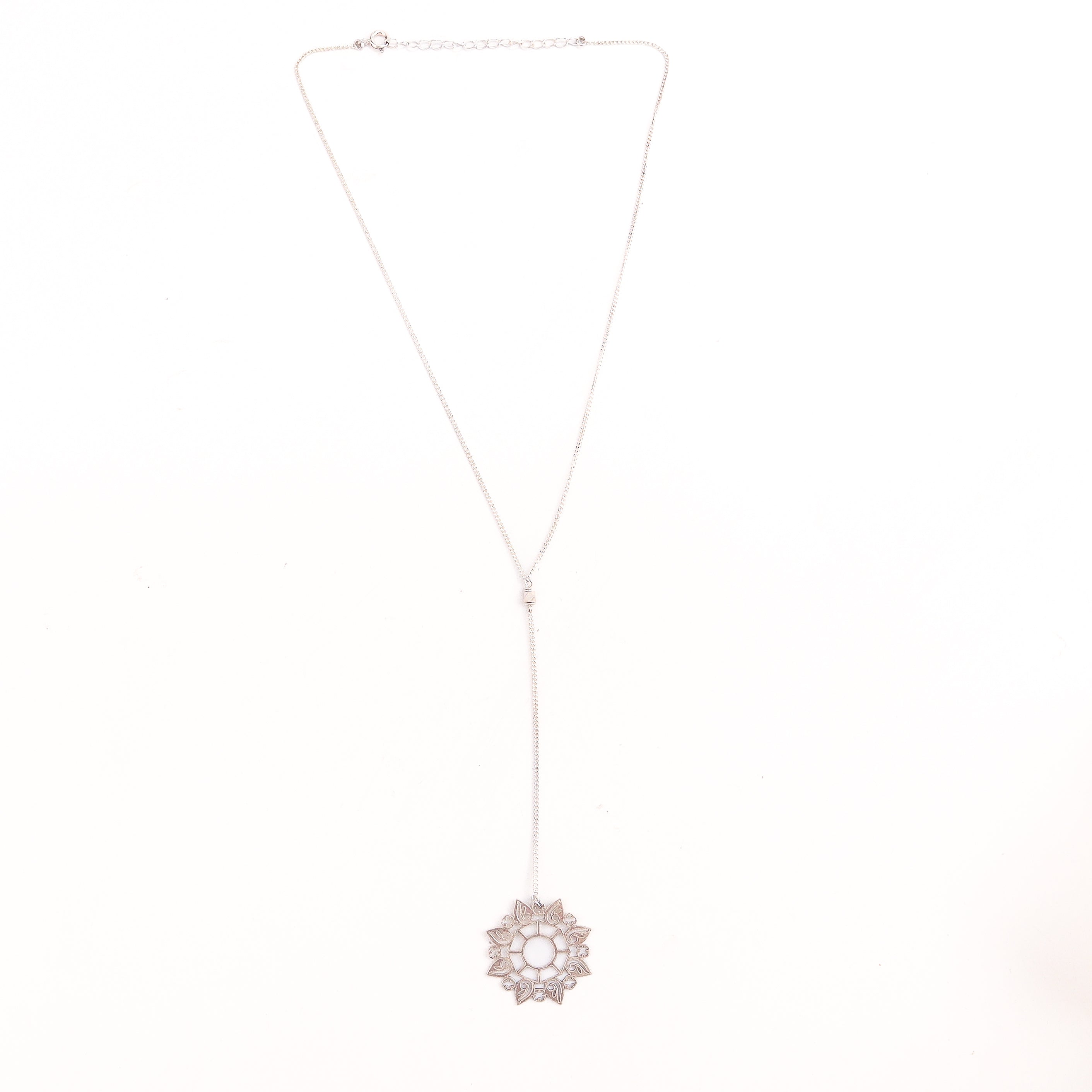 Detail shot of rosebud motif and polished silver finish