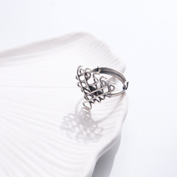 Saraswati Ring Small silver jewelry on white shell