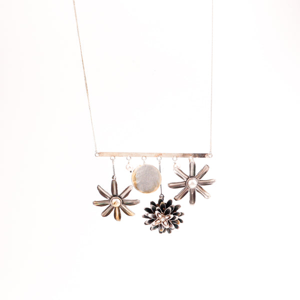 Angled side view of Silver Snowflake Filigree Earring