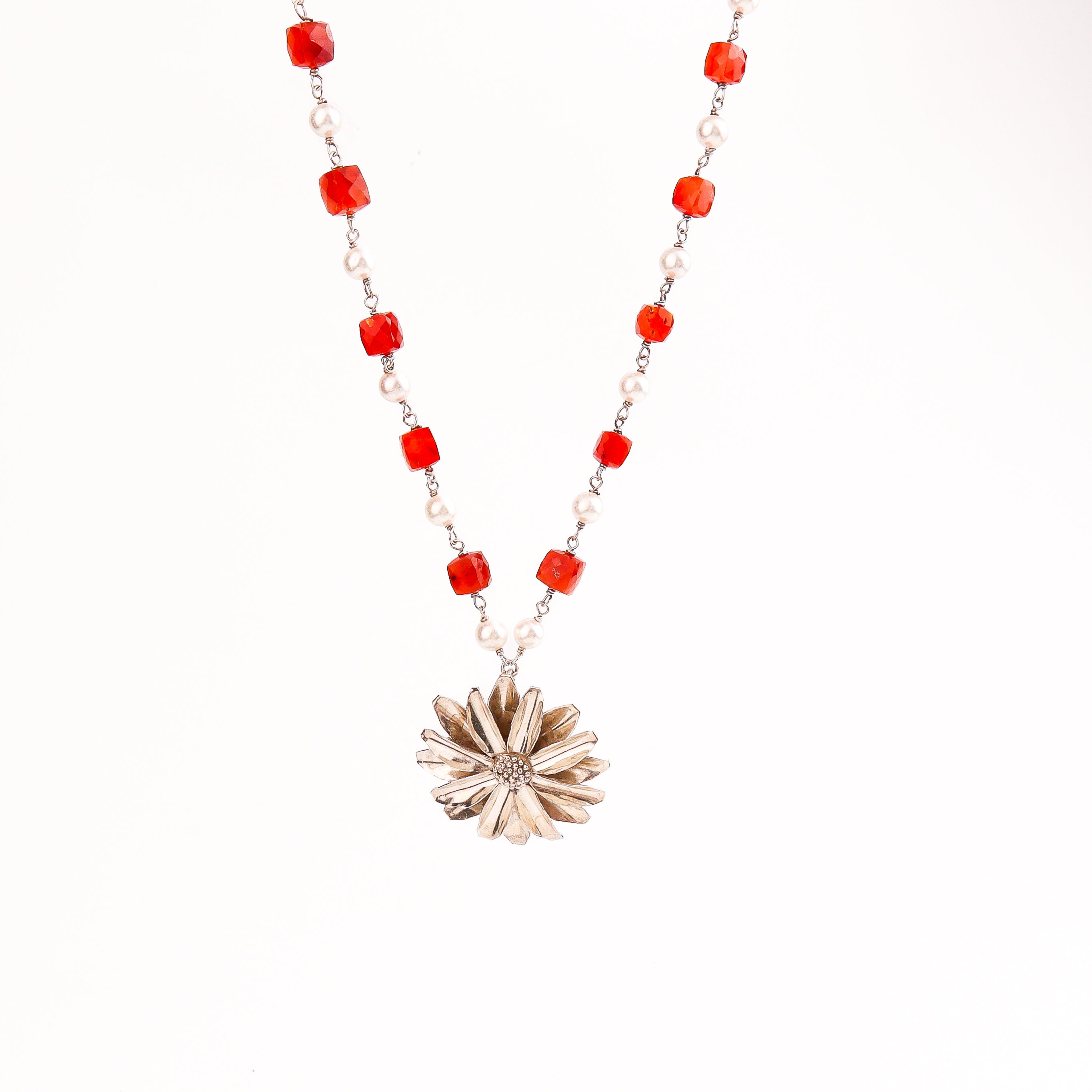 Detail shot highlighting pearl gathan and silver craftsmanship