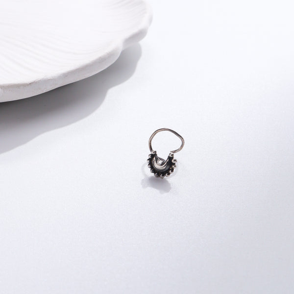 Silver nose pin with traditional design for women
