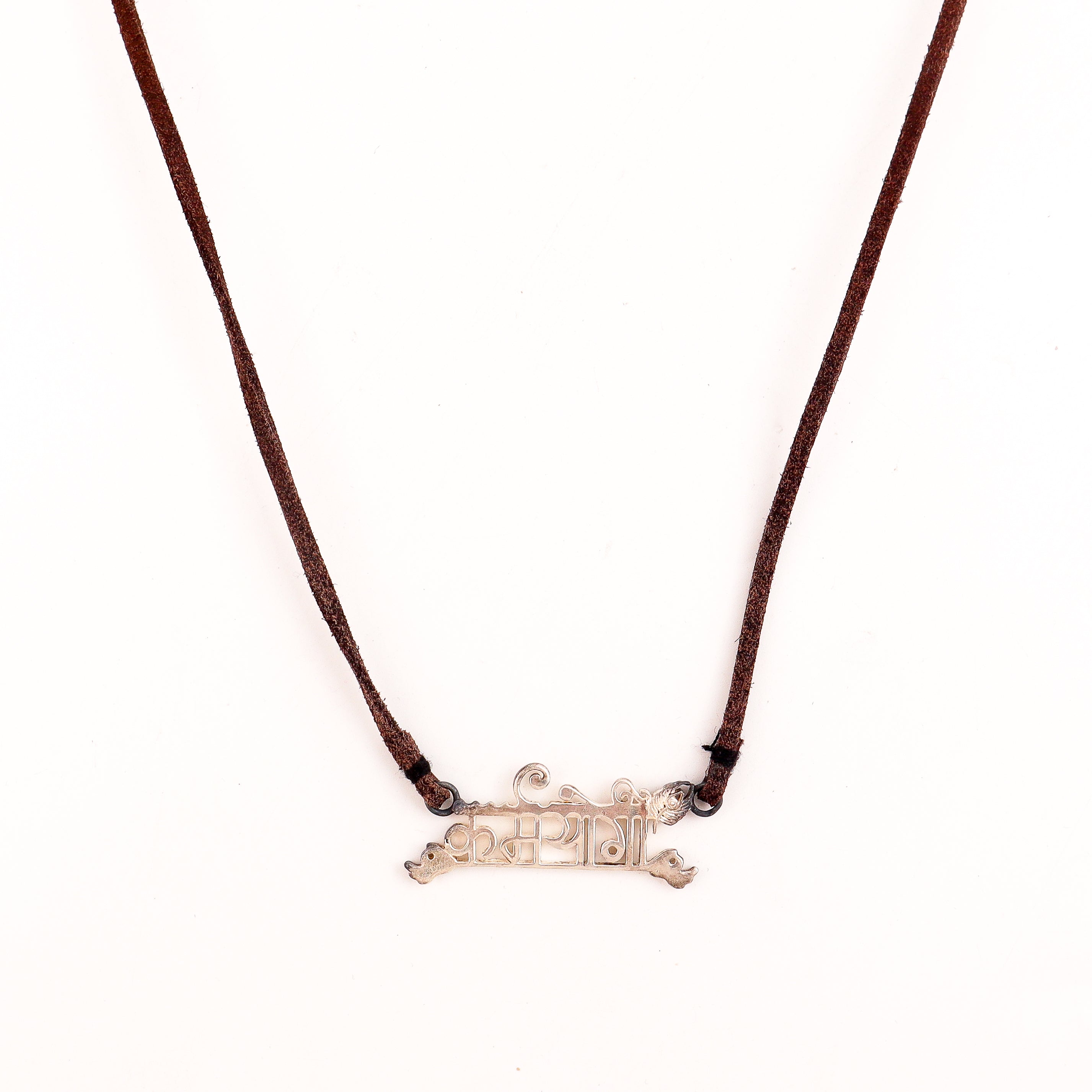 Karmayogi silver necklace styled with casual contemporary outfit