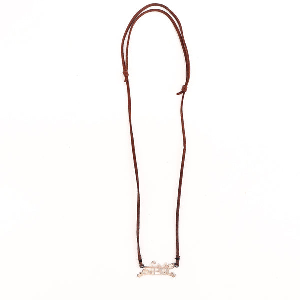 Detail shot highlighting precision-cut lettering and silver finish