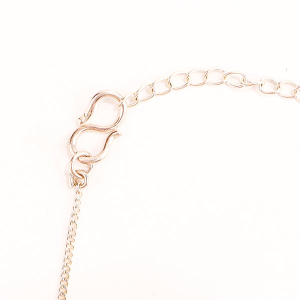 wearing Karmayogi silver necklace for modern styling