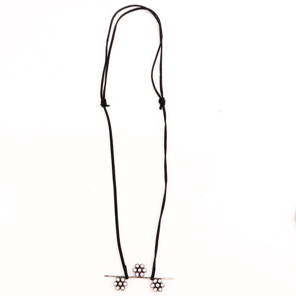 Detail shot highlighting silver craftsmanship and motif structure