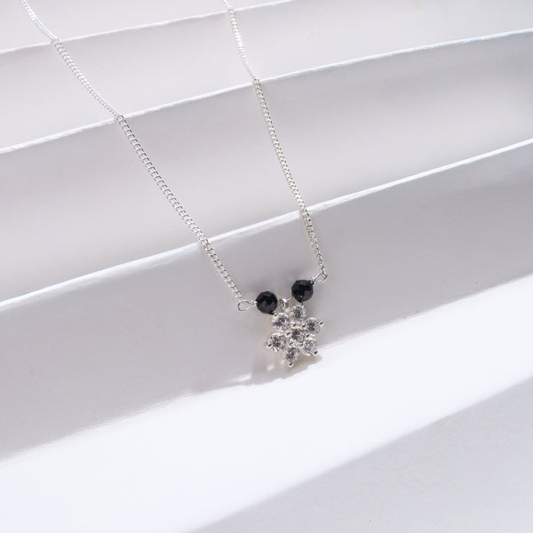 Silver chain with black and clear gemstone pendant
