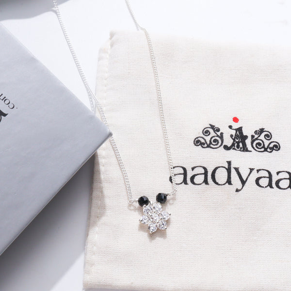 Silver floral pendant necklace with cubic zirconia stones