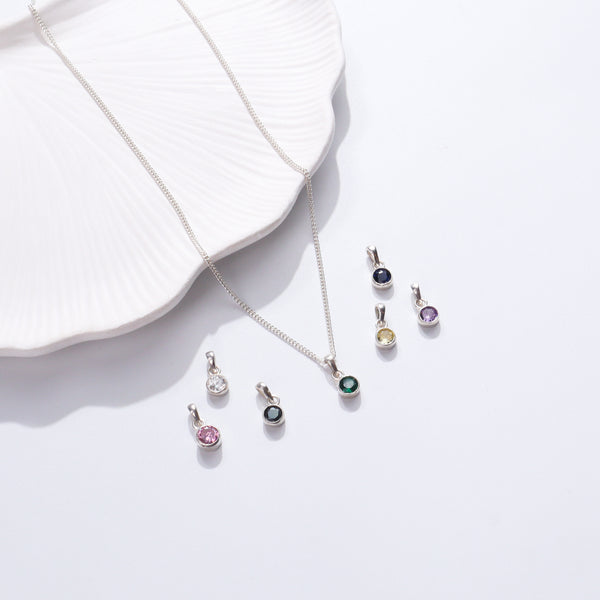 Silver necklace with colorful gemstone pendants