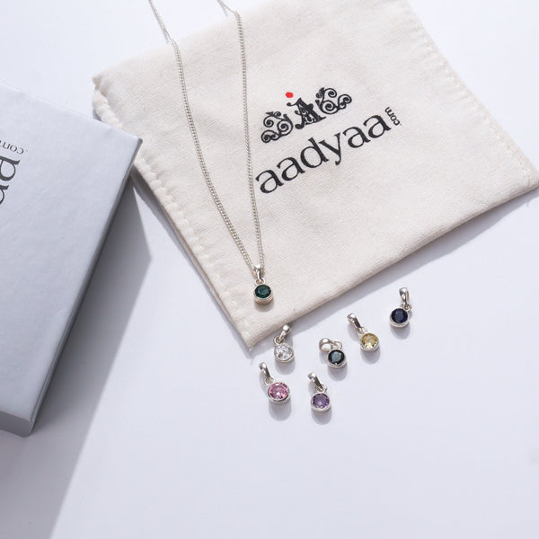 Silver necklace with green gemstone pendant