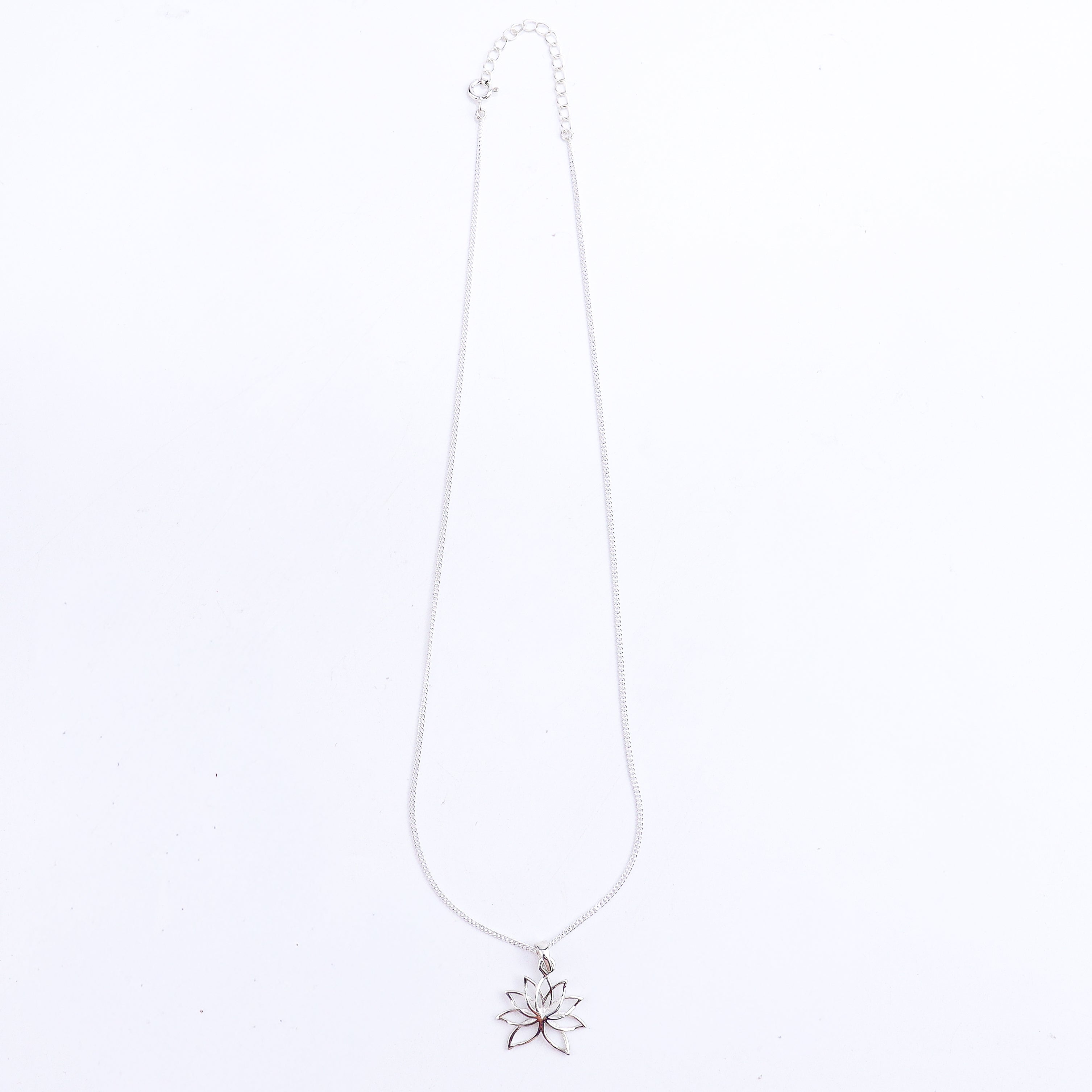 Detail shot highlighting polished silver lotus finish