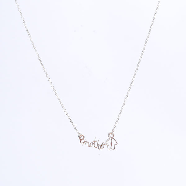 Detail shot highlighting polished silver finish of mother pendant