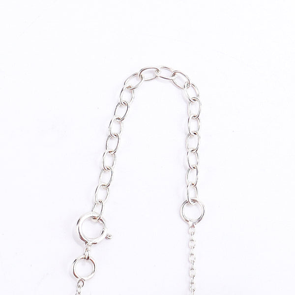 Mother pendant silver necklace styled with modern outfit