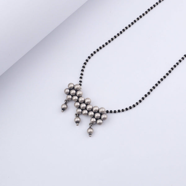 Detail shot of Silver Kudi motif with textured silver finish