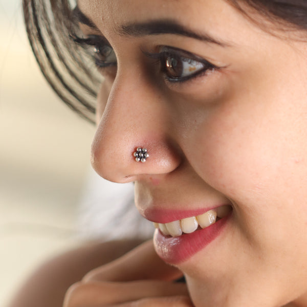 kudi motif detailing on small silver nose pin