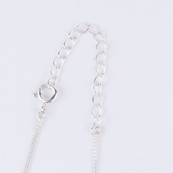 Shoe silver pendant styled with modern outfit