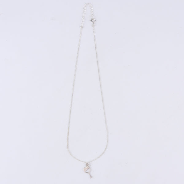 Wine glass silver pendant styled with dress and modern outfit