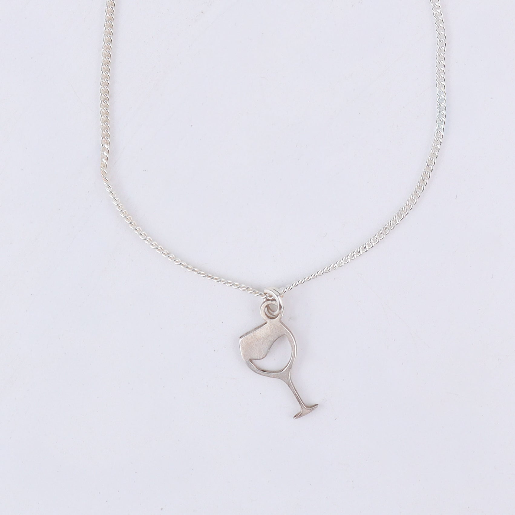 wine glass pendant detailing in silver