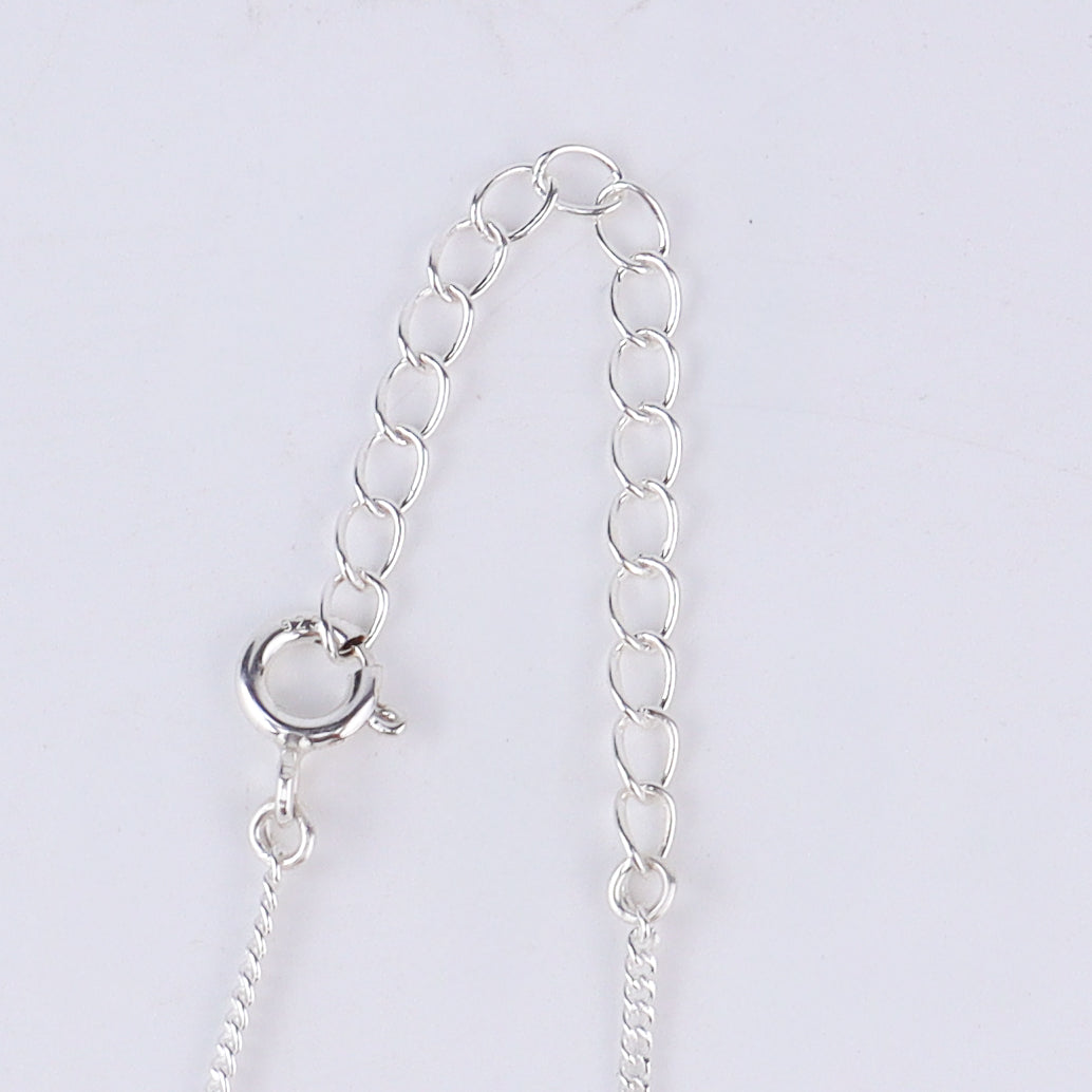 Tic tac toe silver pendant styled with modern outfit