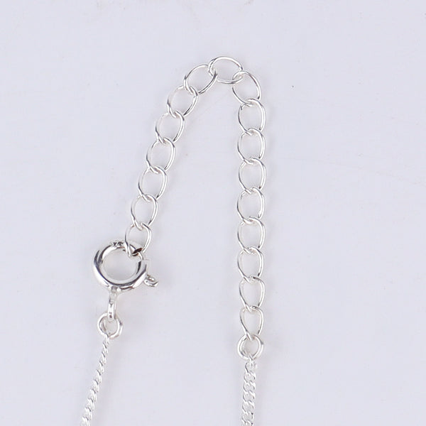 Tic tac toe silver pendant styled with modern outfit