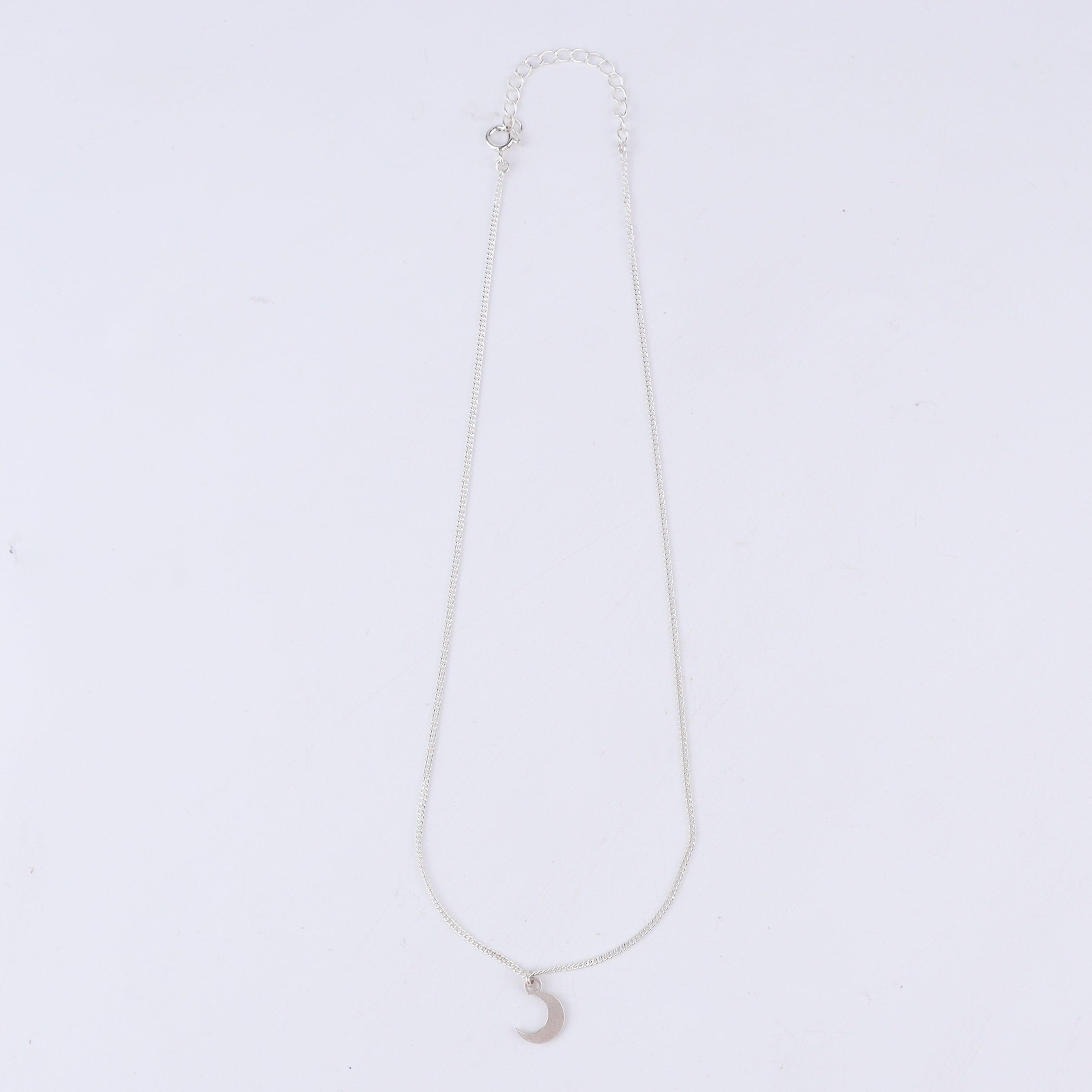 Flat-lay moon pendant necklace