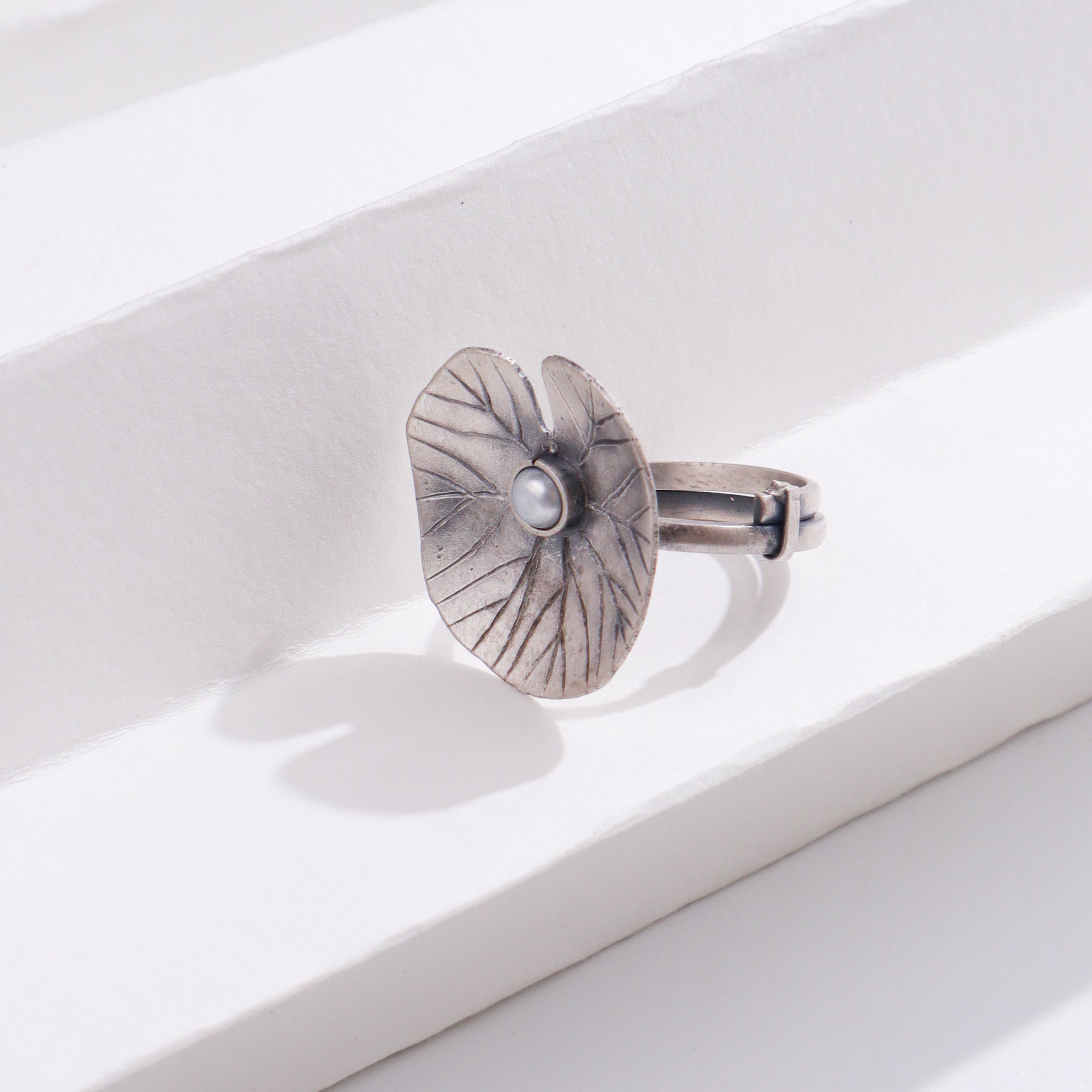 Silver flower ring with pearl center