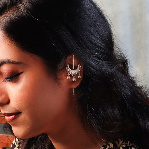 Earrings with intricate crescent moon and ghungroo design in silver