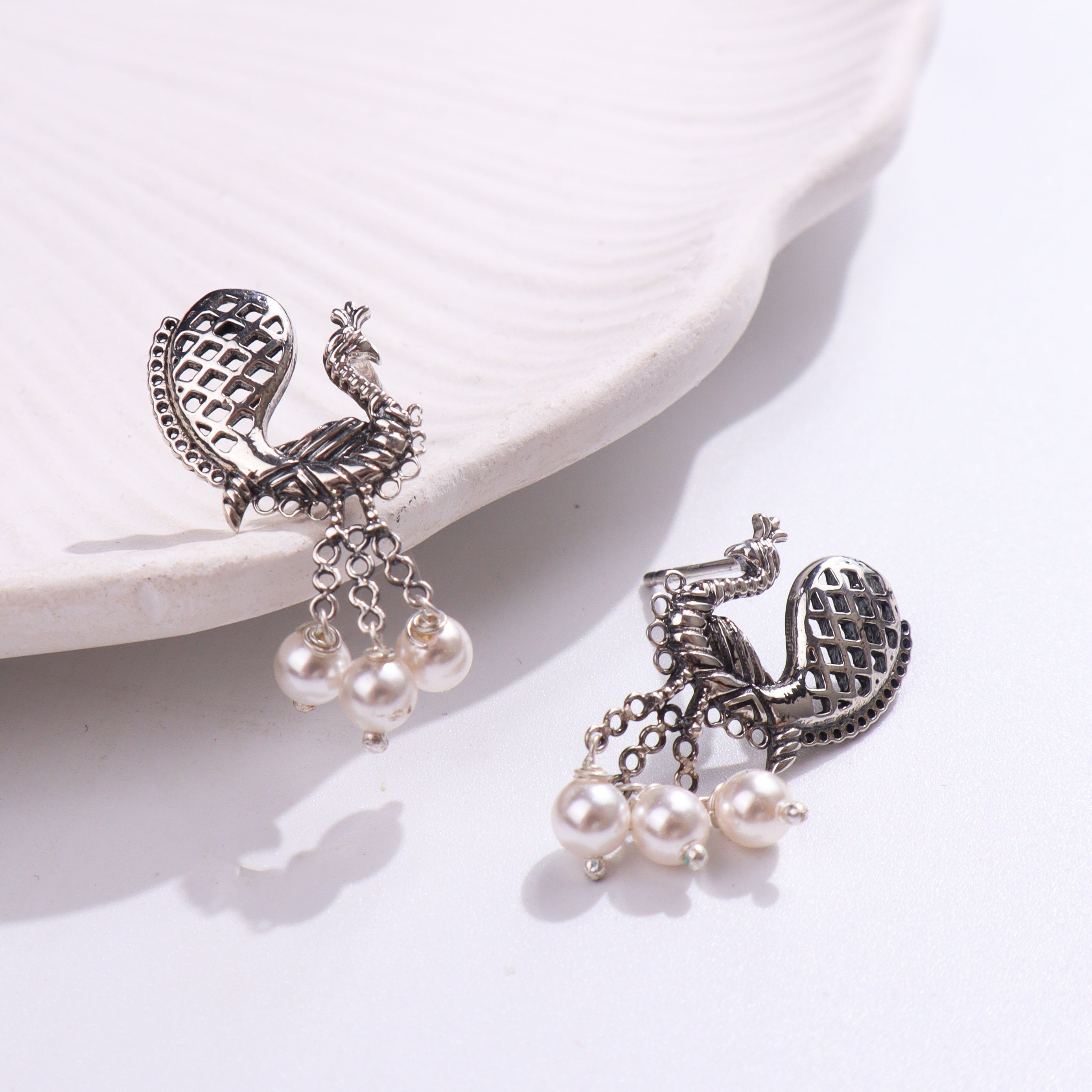 Silver peacock earrings with pearls
