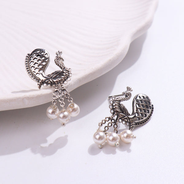 Silver peacock earrings with pearls